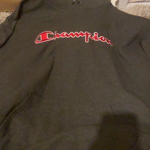 dark grey and red champion pull over hoodie